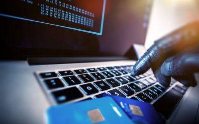 Unauthorized Payments Credit Cards Theft Concept. Hacker with Credit Cards on His Laptop Using Them For Unauthorized Shopping. Unauthorized Payments